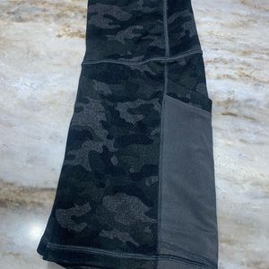 Black and gray Fabletics biker shorts, size small